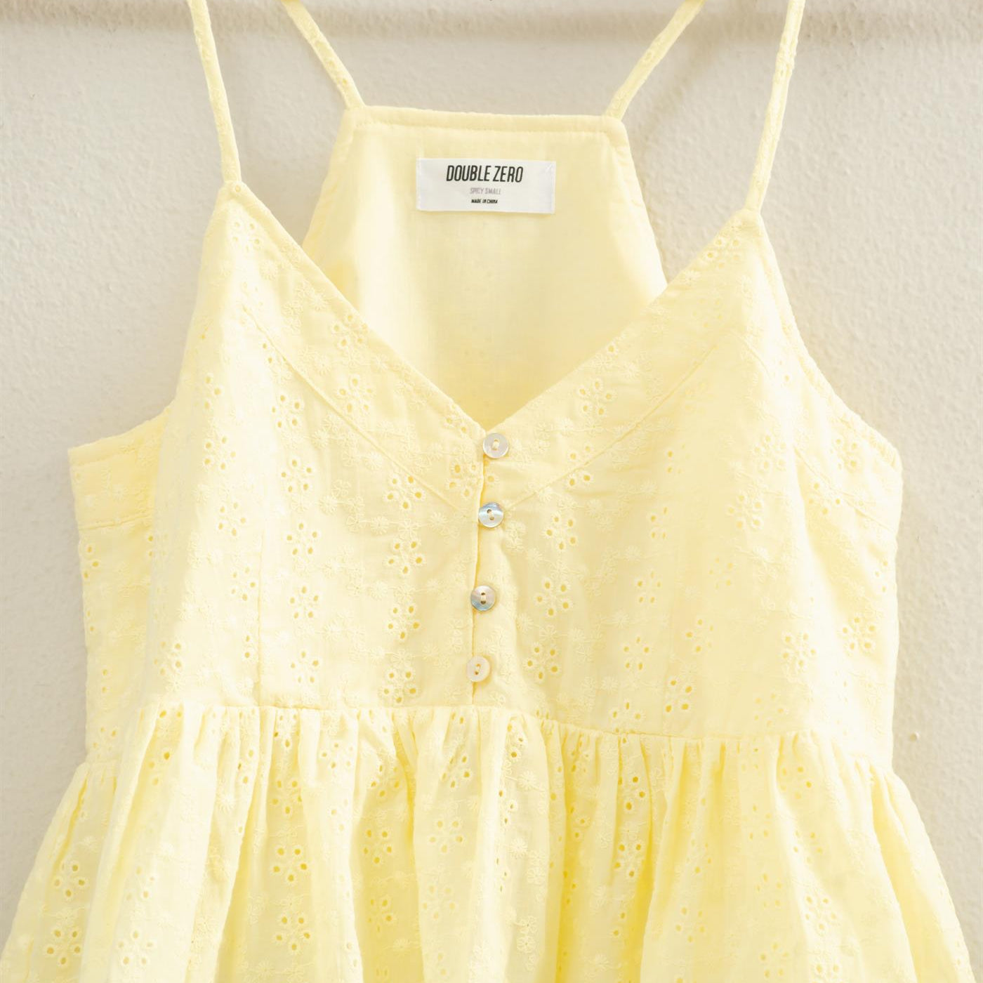 Wholesale Eyelet Button Detail Peplum Top Camisoles DZ26A783 PALE YELLOW DOUBLE ZERO